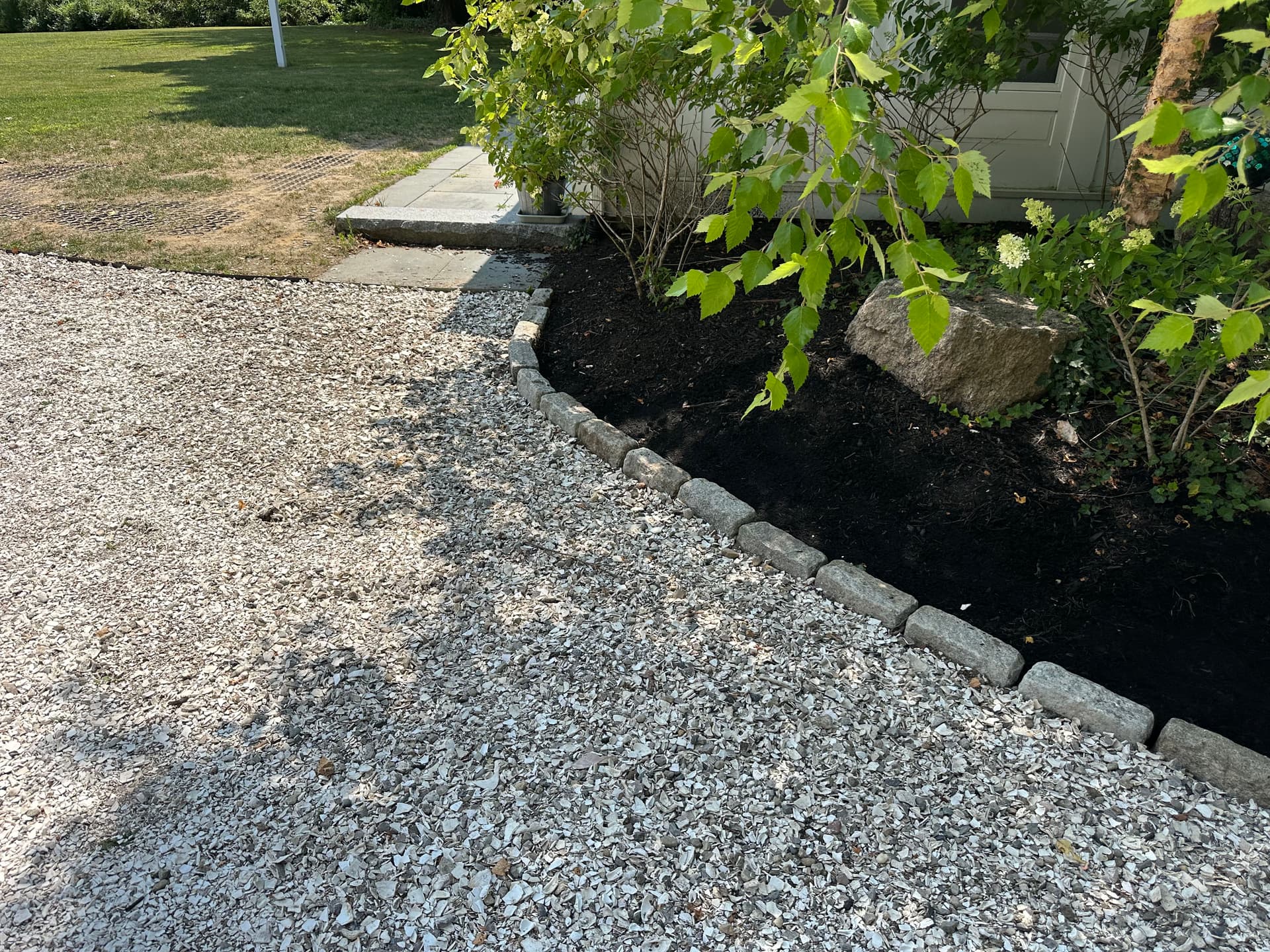 Gallery photos for Landscape Bed Rebuild with Boulder Borders, Metal Edging, and Fresh Mulch: Image #4