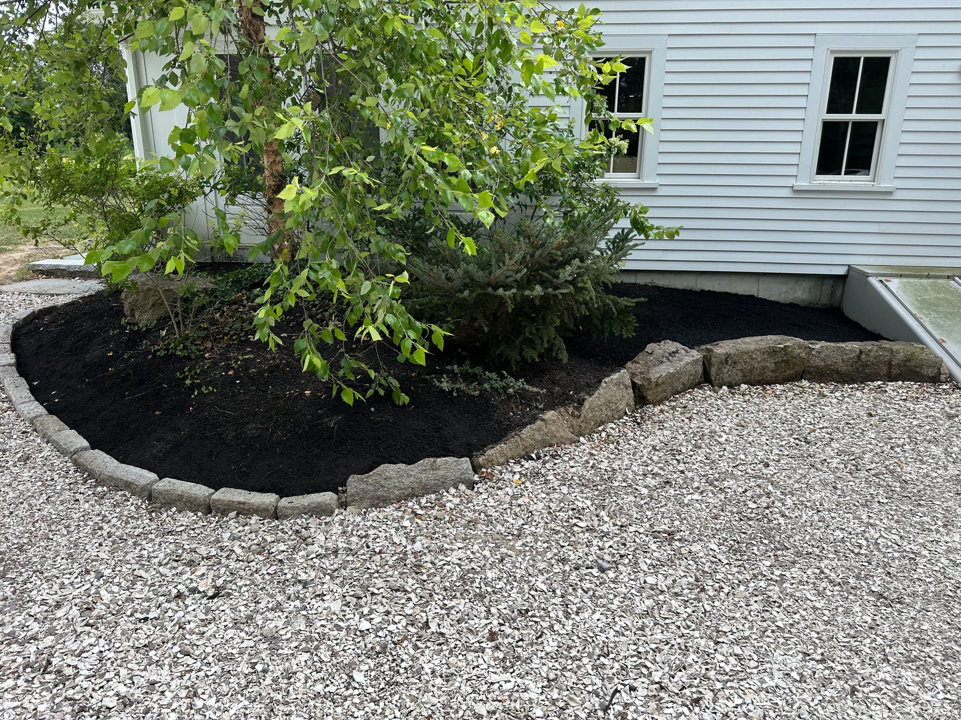 Gallery photos for Landscape Bed Rebuild with Boulder Borders, Metal Edging, and Fresh Mulch: Image #2