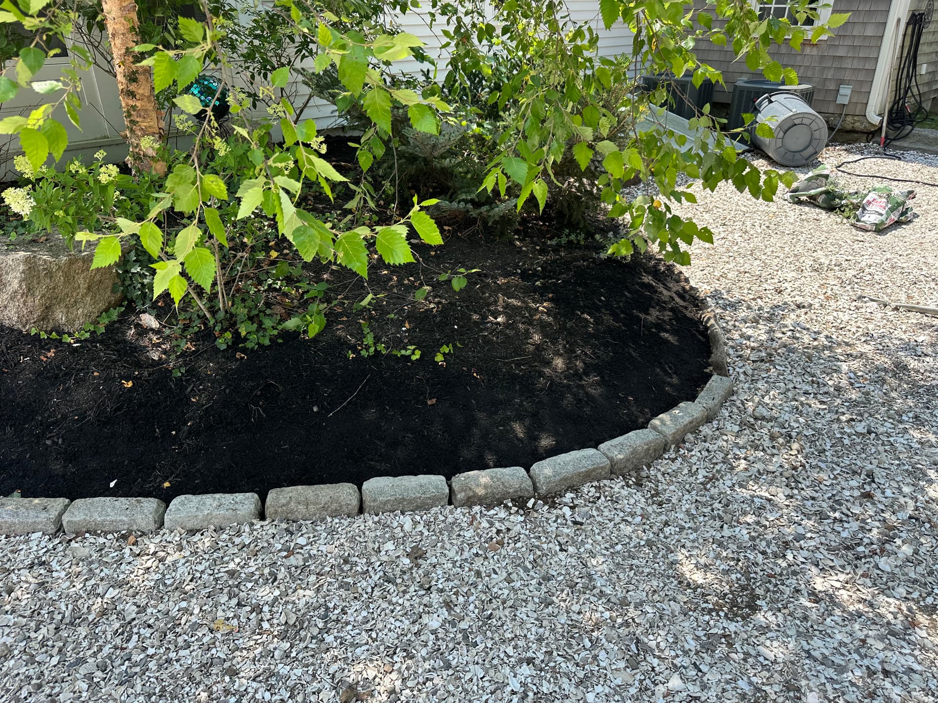 Gallery photos for Landscape Bed Rebuild with Boulder Borders, Metal Edging, and Fresh Mulch: Image #3