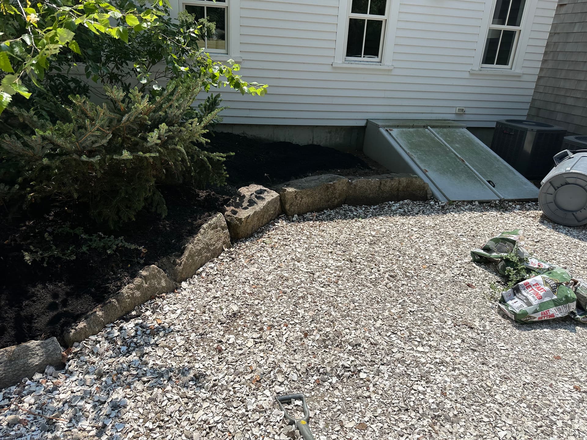 Gallery photos for Landscape Bed Rebuild with Boulder Borders, Metal Edging, and Fresh Mulch: Image #1